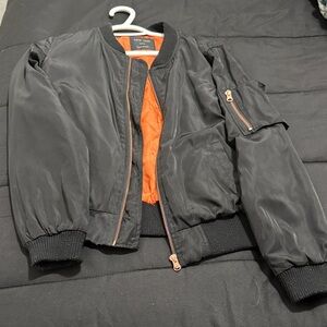 Black Bomber Jacket with Orange Lining